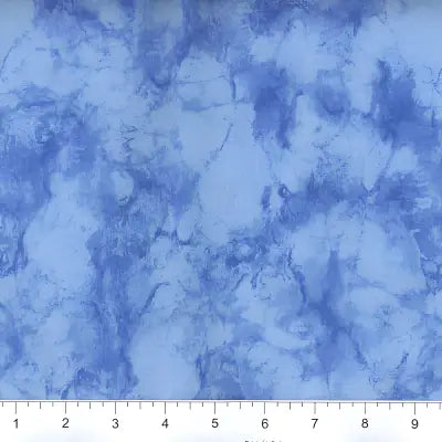 Blue marbled fabric featuring watercolor patterns in 108’’ Marble - Light Blue design