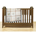 Wooden baby crib adorned with Aunt Martha’s Quilting Fabric in Multi Stripe Print